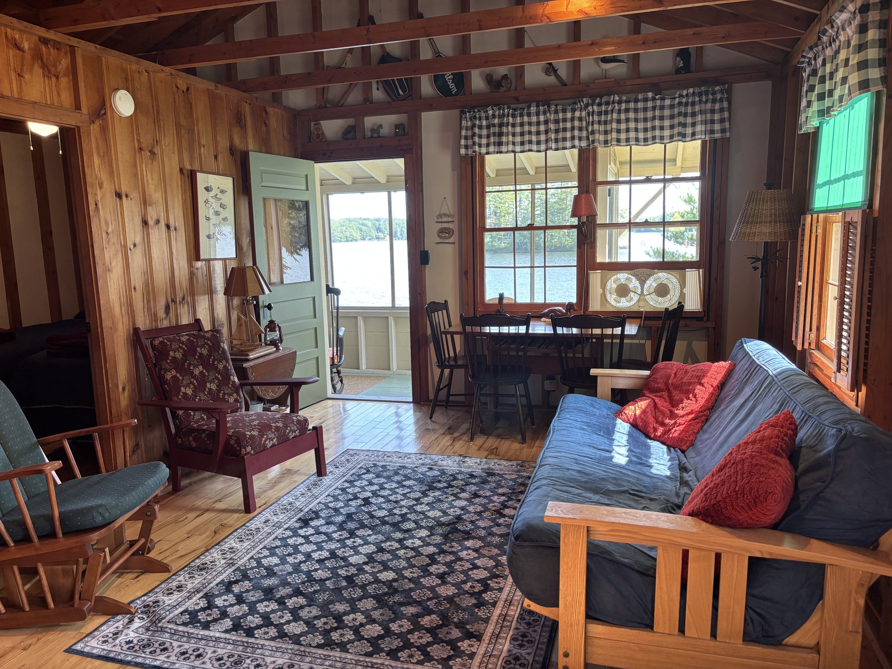 Harmony cabin living room with lake-view windows