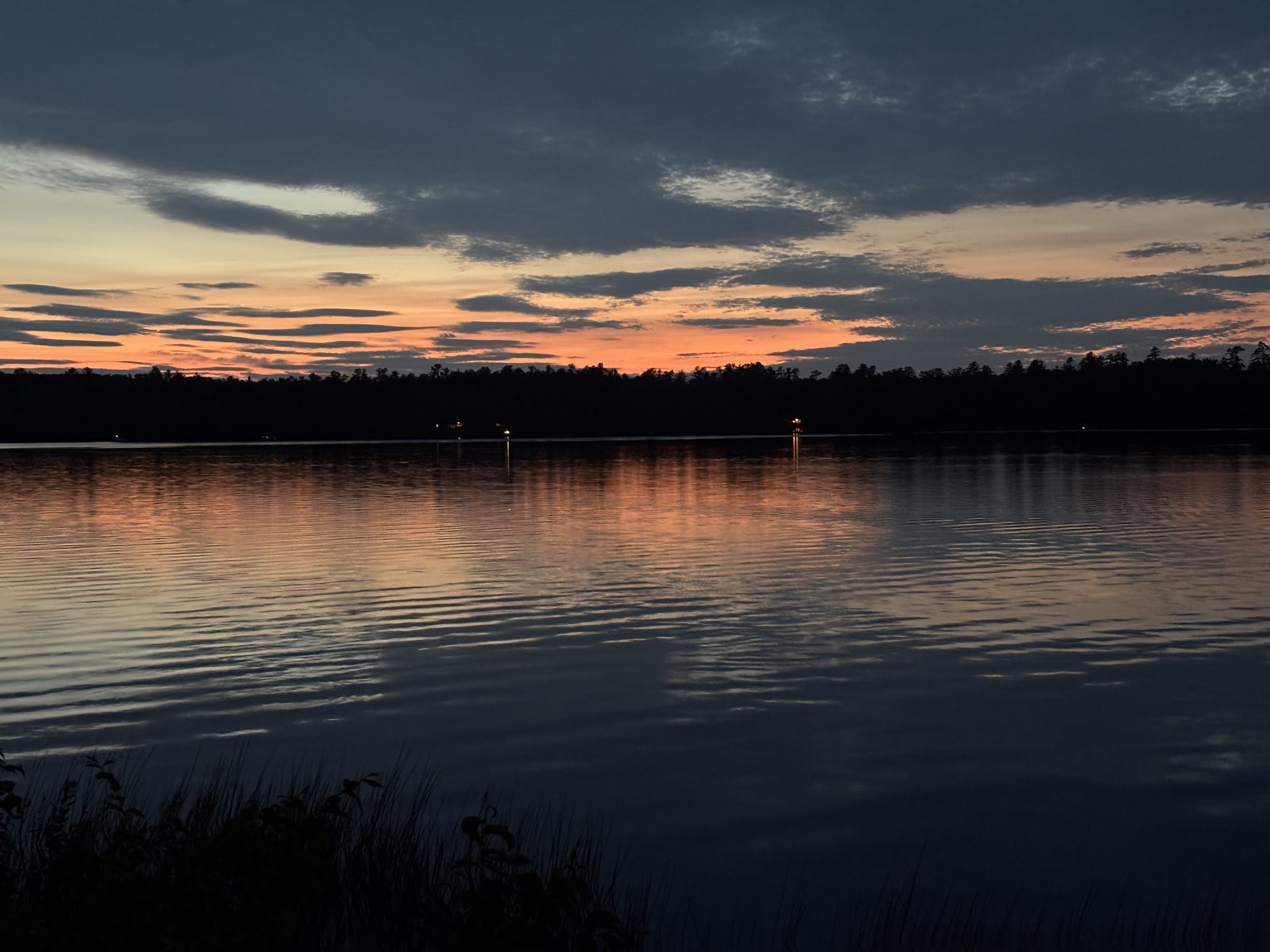 Sunset over Maranacook Lake, viewed from the shore at Loon Cove