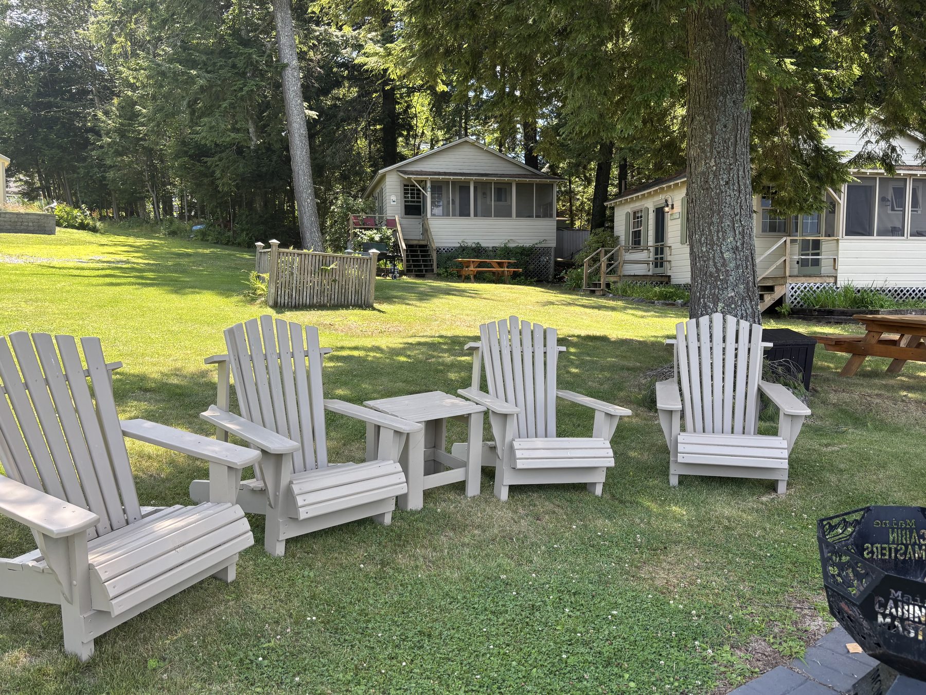Circle of Adirondack chairs in the yard
