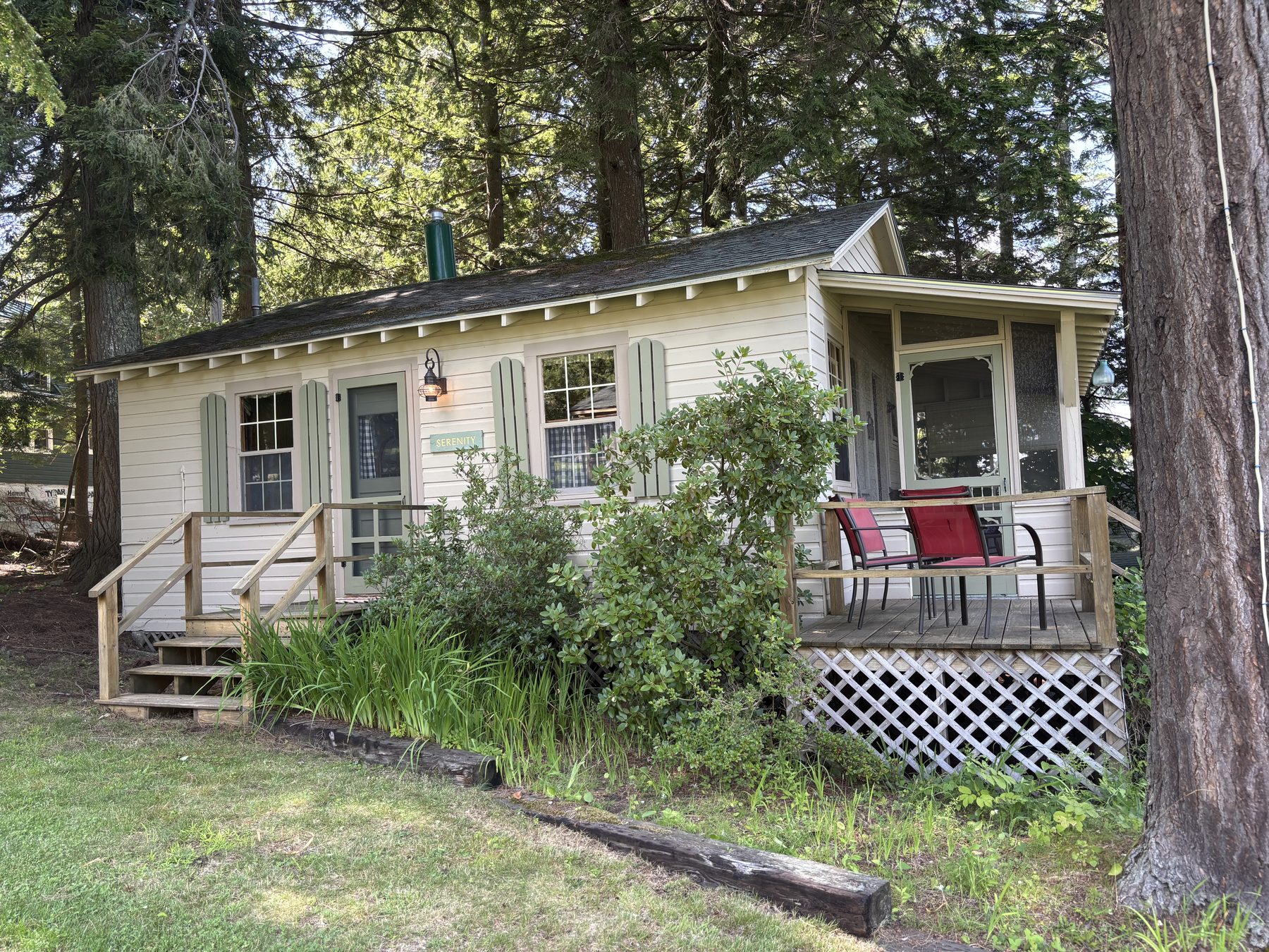 Exterior of Serenity cabin with its nameplate sign and deck